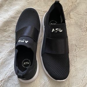 APL slip in black athletic shoes